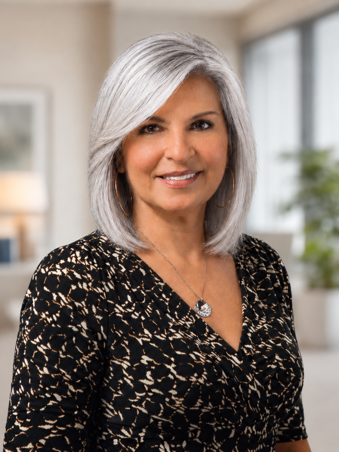Portrait of Patty Donti of Solutions First Financial Group, smiling in a bright office