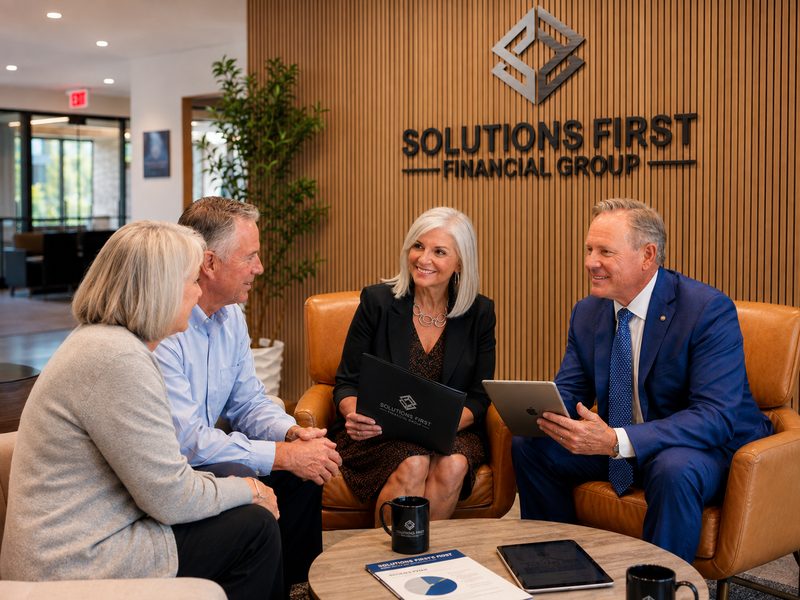 Joe and Patty Donti of Solutions First Financial Group meeting with a Scottsdale couple in the office lobby